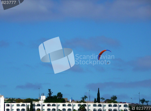 Image of Parachutist Over Apartments