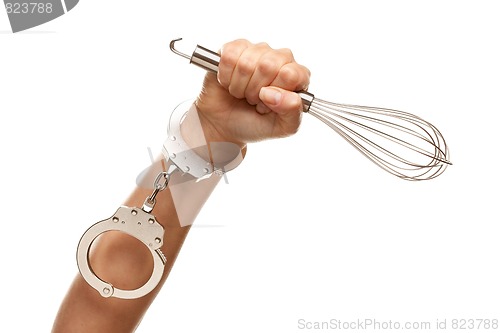 Image of Handcuffed Woman Holding Egg Beater in Air on White