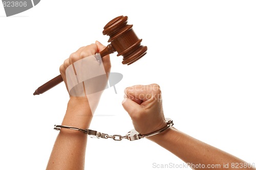 Image of Handcuffed Woman Holding Wooden Gavel on White