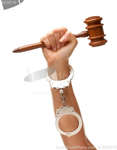 Image of Handcuffed Woman Holding Wooden Gavel on White