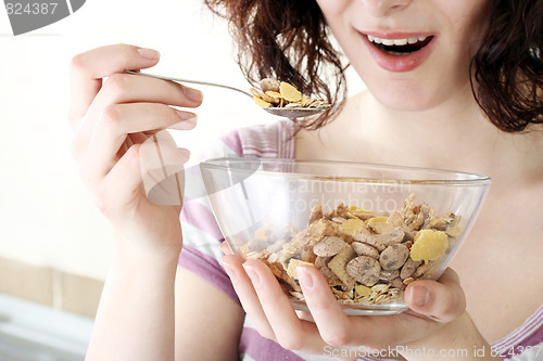 Image of Young people eating milk with cereals