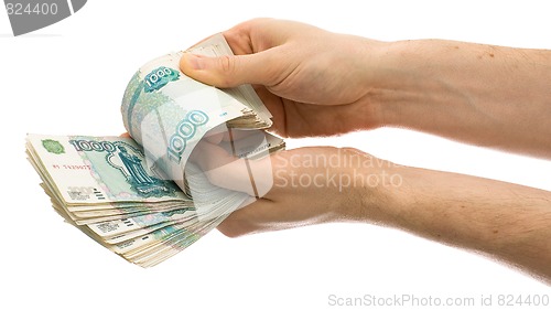 Image of Hands counting roubles