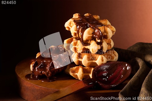 Image of chocolate syrup and Belgian waffles