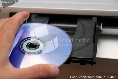 Image of insert CD on CD player