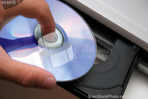 Image of insert CD on CD player