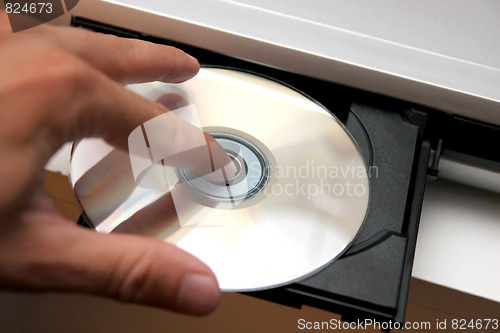 Image of insert CD on CD player