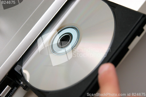 Image of insert CD on CD player