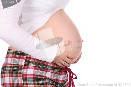 Image of pregnant woman holding belly