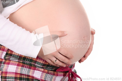 Image of pregnant woman holding belly
