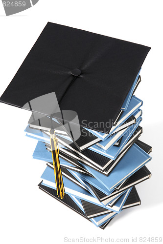 Image of graduation cap and books