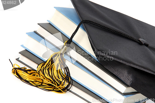 Image of graduation cap and books