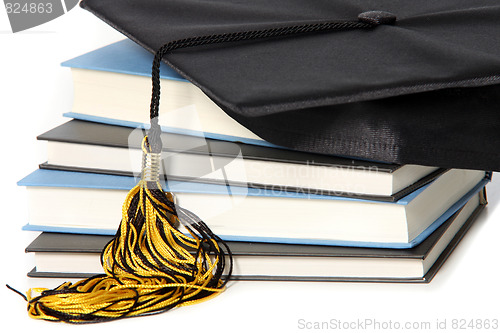 Image of graduation cap and books