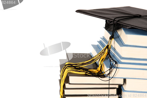 Image of graduation cap and books