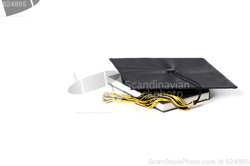 Image of graduation cap and books