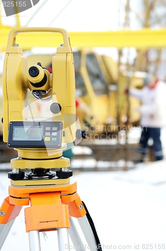 Image of land surveyor theodolite equipment at construction site