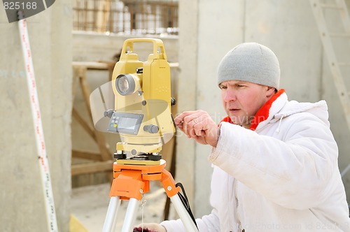 Image of surveyor worker at construction site