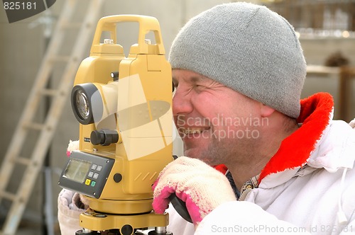 Image of Land surveyor on construction site