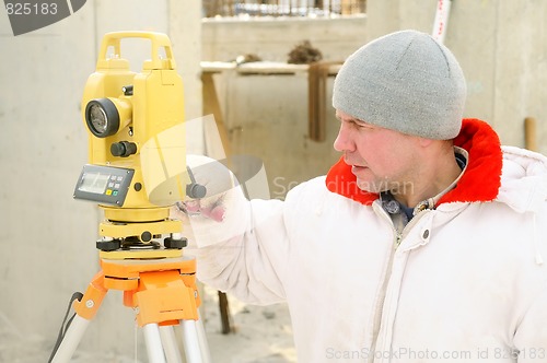 Image of surveyor worker at construction site