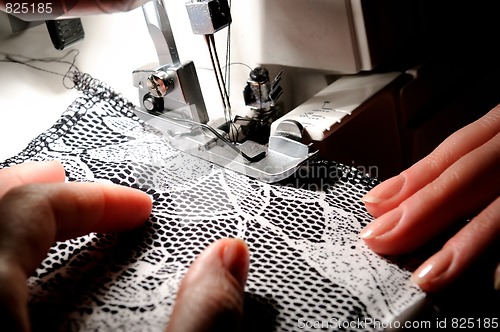 Image of hand sewing on the machine