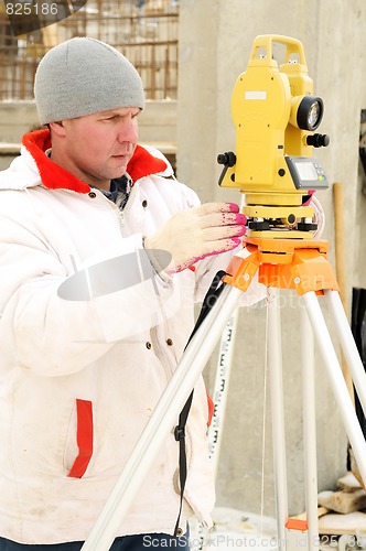 Image of surveyor worker at construction site