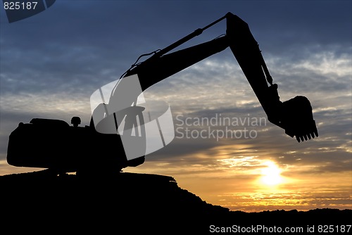 Image of Loader excavator over sunset