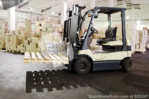 Image of Forklift stacker in warehouse