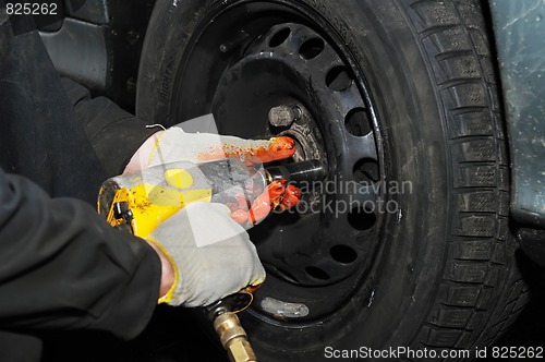 Image of tyre fitting with air compressed wrench