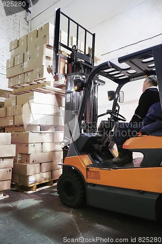 Image of Forklift loader in warehouse