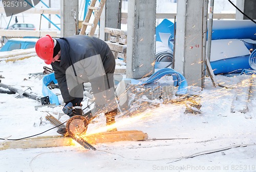 Image of worker at building construction site