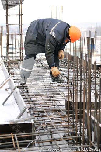 Image of worker at building construction site