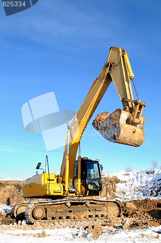 Image of loader excavator in open cast in winter