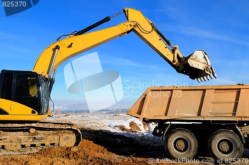 Image of loader excavator and rear-end tipper dumper