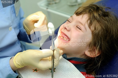 Image of smiling girl at a dentist examination