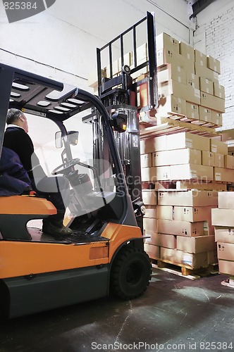 Image of Forklift loader in warehouse