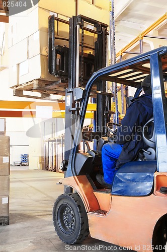 Image of warehouse forklift loader work