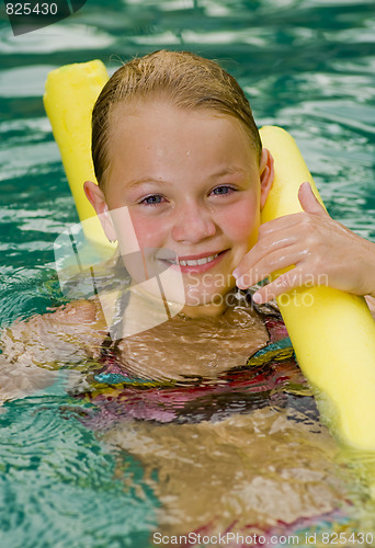 Image of blonde girl with a styrofoam noodle