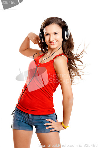 Image of Young girl listen music