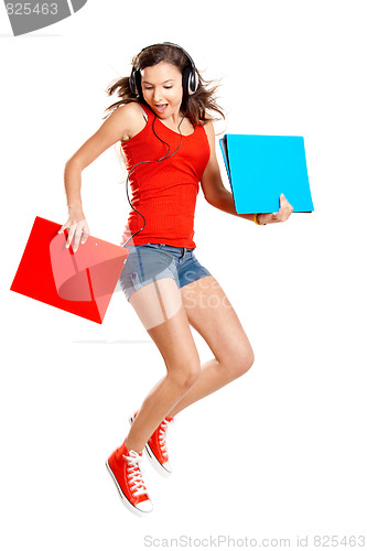 Image of Young girl listen music