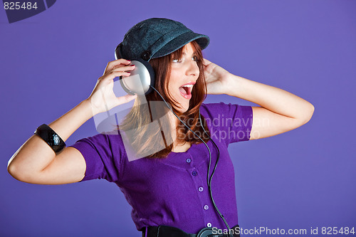 Image of Beautiful woman listening music