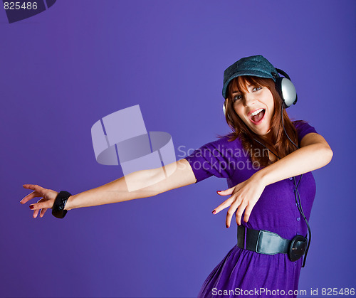 Image of Beautiful woman listening music