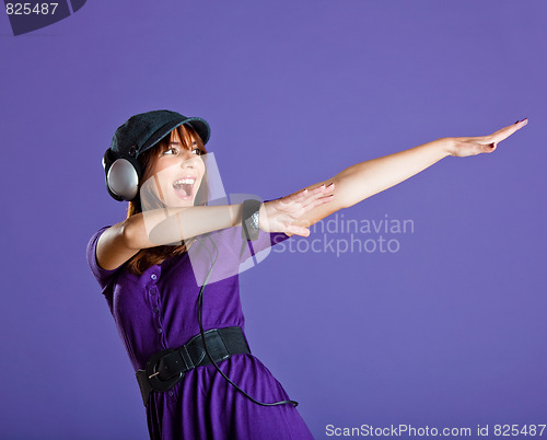 Image of Beautiful woman listening music