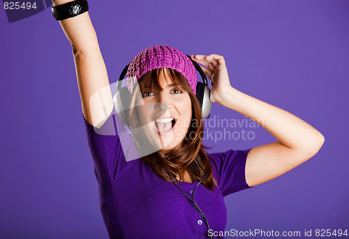 Image of Beautiful woman listening music