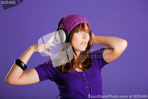 Image of Beautiful woman listening music