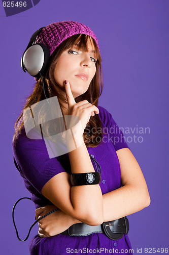 Image of Beautiful woman listening music