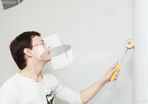 Image of Painter worker decorator with roller