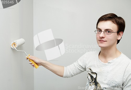 Image of Painter worker decorator with roller