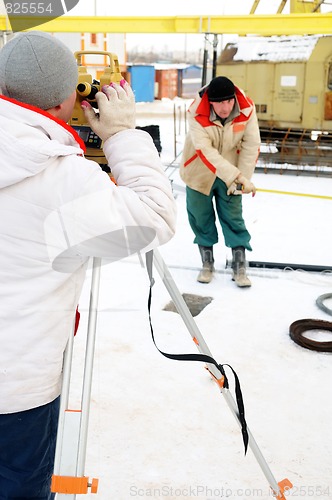 Image of surveyor worker at construction site