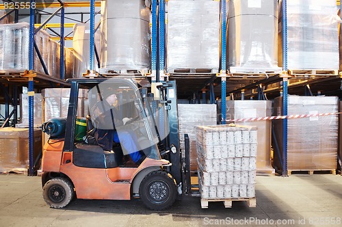 Image of warehouse work with forklift loader