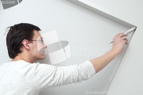 Image of Painter worker decorator with brush