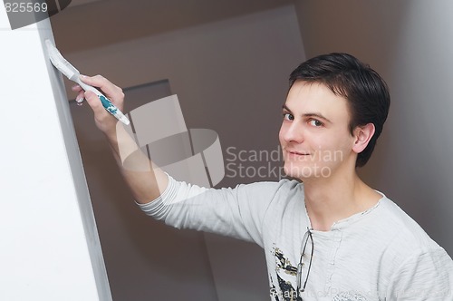 Image of Painter worker decorator with brush